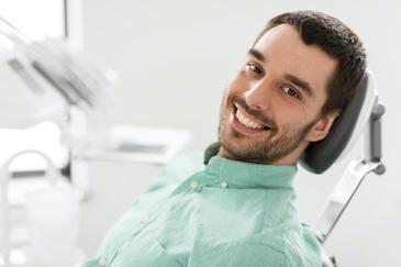 man smiling in dental chair